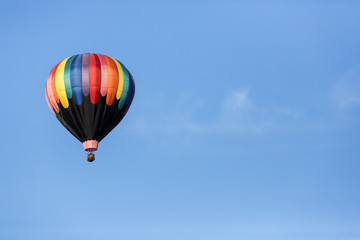 Hot air balloons flying in a beautiful blue clear sky