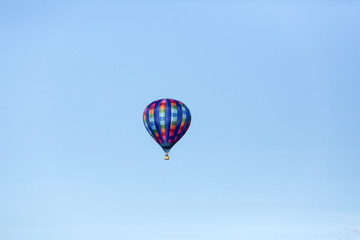 Hot air balloons flying in a beautiful blue clear sky