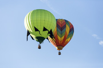 Hot air balloons flying in a beautiful blue clear sky