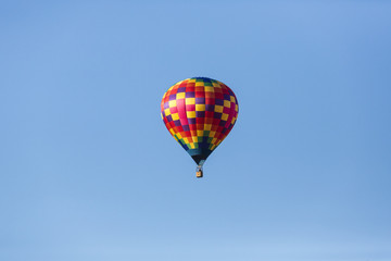 Hot air balloons flying in a beautiful blue clear sky