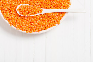 lentils on white wooden background