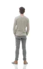 Rear view. Full length. Young man in gray sweater