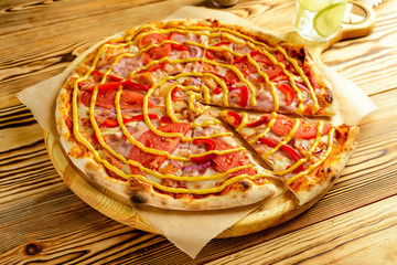 Delicious pizza margherita served on wooden plate