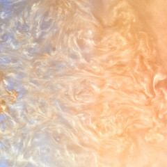 golden paint in water abstract background with waves. shiny particles spread out