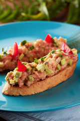 Salmon and avocado tartare with toast