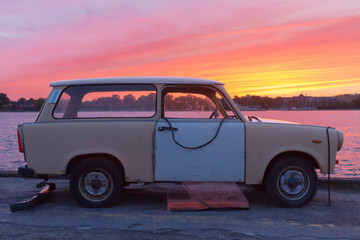 Old car in front of sunset - 222873960