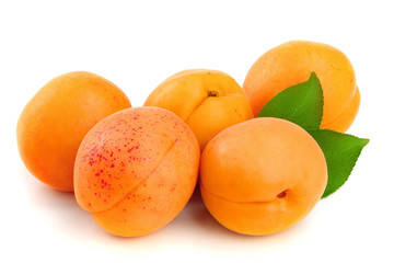 Apricot fruits with leaves isolated on white background macro