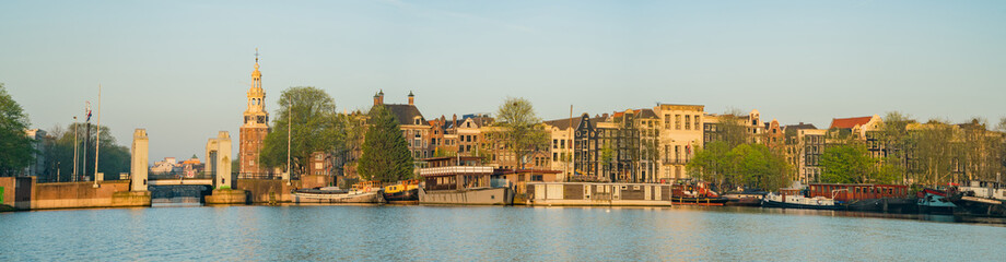 Fototapeta premium Morning view of the historical Montelbaanstoren Tower and cityscape