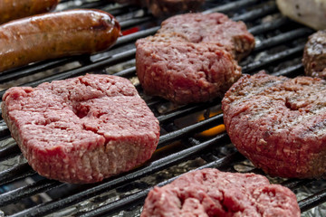 Grilling Meats at Outdoor Picnic