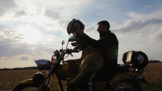 Man clothes helmet sitting motorcycle