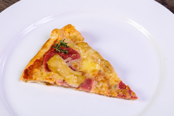 Pizza with ham and sausages