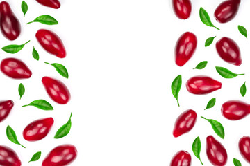 Red berries of cornel or dogwood decorated with green leaves isolated on white background with copy space for your text. Top view. Flat lay