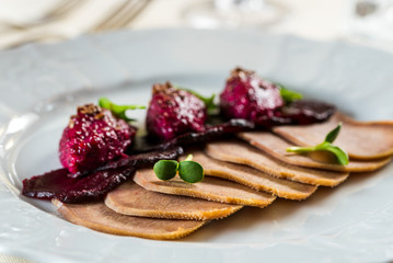 boiled sliced pork tongue with red food beetroot