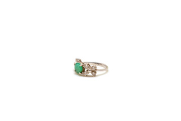 Gold ring with emerald on white isolated background