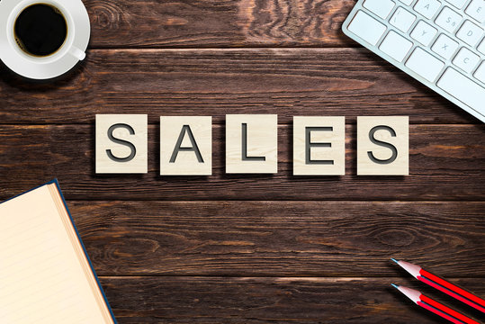 Business synonyms made from wooden blocks on office table