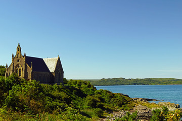 Church on the shore of a lake in Scotland