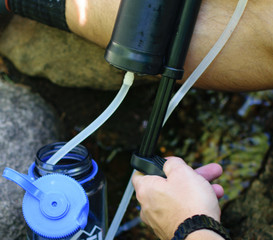 Filtering Water into a water bottle while camping