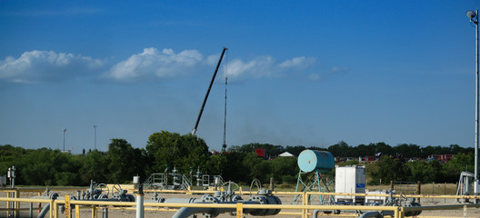 Oil and Gas Surface Refinery with Operations in the Background