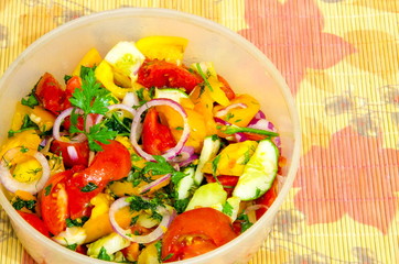 
Juicy slicing from different vegetables in the form of salad.