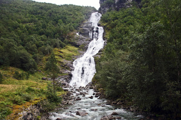 Fototapeta na wymiar View of the big waterfall. Jotunheimen National Park. Norway