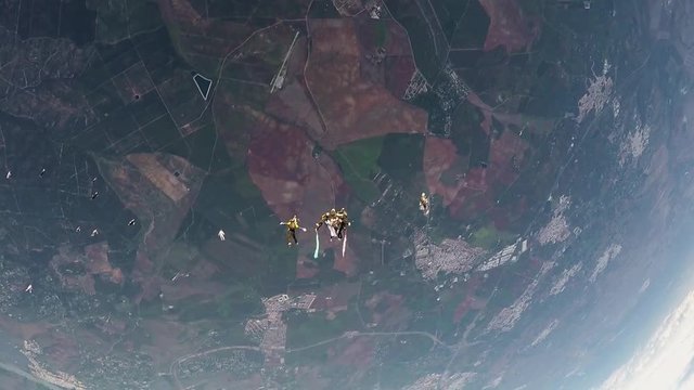 Skydivers team make formation in sky. Holding hands. Speed. Extreme. Falling. Adrenaline.