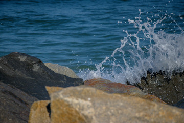 waves splash on rocky beach