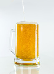 Oktoberfest. Beer with foam and bubbles on white background.