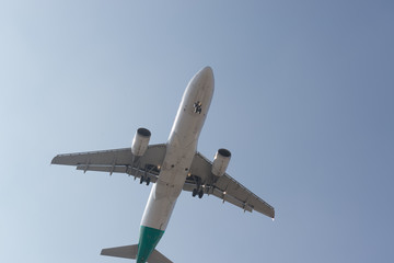 Airplane flying high departing from the airport