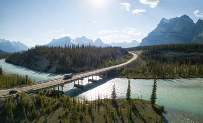 Beautiful aerial landscape view of a highway in Canadian Rockies during a vibrant sunny day. Taken...