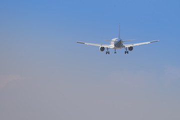 Big airplane flying with the land gear down