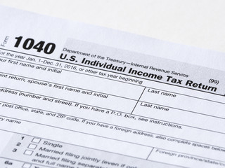 Close up of a 1040 tax return filing form for individual income reporting in the United States.