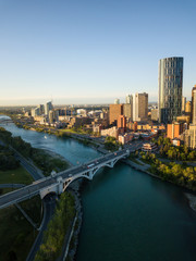 Aerial view of a beautiful modern cityscape during a vibrant sunny sunrise. Taken in Calgary...