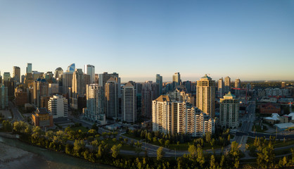 Fototapeta na wymiar Aerial panoramic view of a beautiful modern cityscape during a vibrant sunny sunrise. Taken in Calgary Downtown, Alberta, Canada.