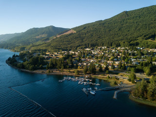 Aerial view of a small town, Port Alice, during a sunny summer sunset. Located in Northern...