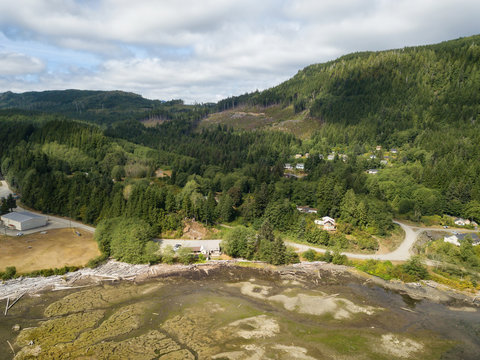 Aerial view of a small town, Holberg, during a sunny summer day. Located in Northern Vancouver Island, BC, Canada.