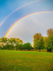 Beautiful colorful double rainbow after a rain storm