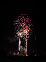 Dazzling Independence day fourth of July real fireworks display exploding in the sky with vivid...