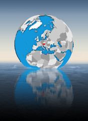 Austria on globe in water