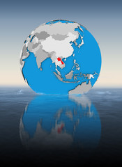 Laos on globe in water