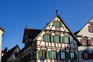 framework facade with window shutters