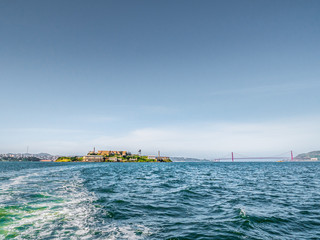 Alcatraz Island with the city of San Francisco and the Golden Gate Bridge in the background across...