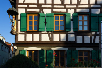 framework facade with window shutters