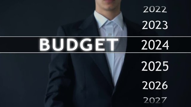 2024 budget, businessman selects file on virtual screen, annual financial report
