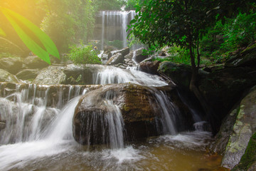 Beautiful waterfalls flow through the rocks in  forest at Soo Da Cave Roi et Thailand.