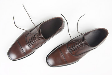 Classic men's brown Oxford shoes on white background. Leather shoes