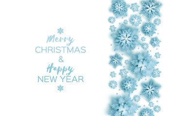 Merry Christmas and Happy New Year Greetings card. Blue Paper cut snowflakes. Origami Winter Decoration background. Seasonal holidays. Snowfall. Space for text.