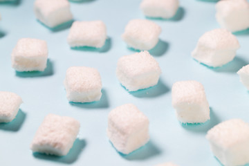 Marshmallow candy on blue