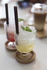 Lemonade soda quenched with drinks as a backdrop.