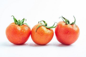 Fresh tomatoes on white background