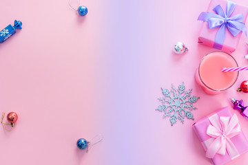 Festive background for text composition flat lay Christmas items gift box ribbon bow pink glass cocktail Christmas toys Top view copy space